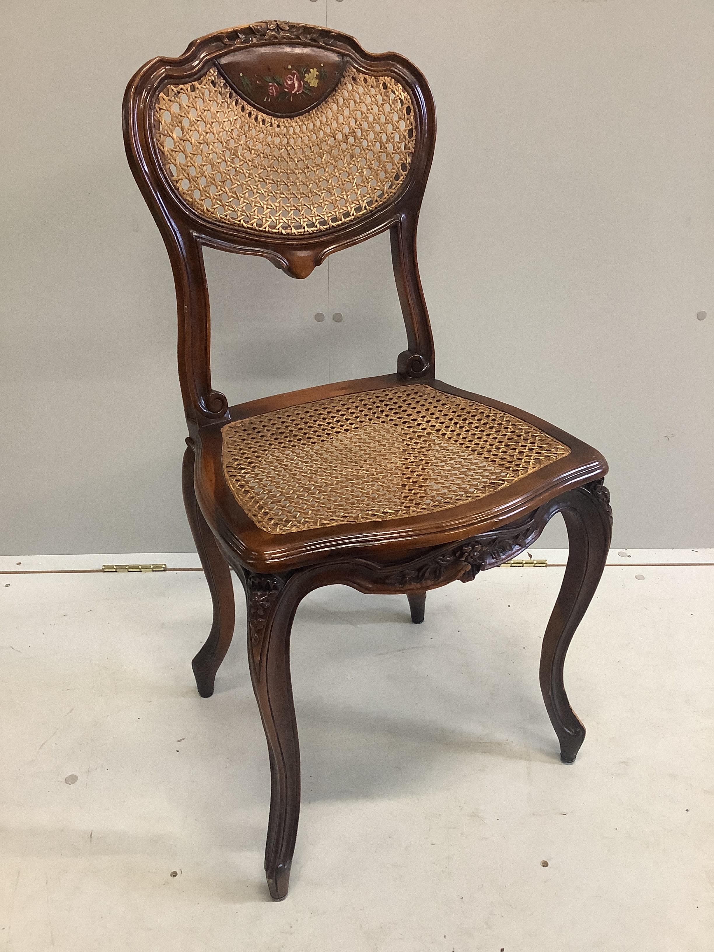 A Theodore Alexander bird's eye maple kneehole writing table, width 114cm, depth 86cm, height 77cm and a caned chair